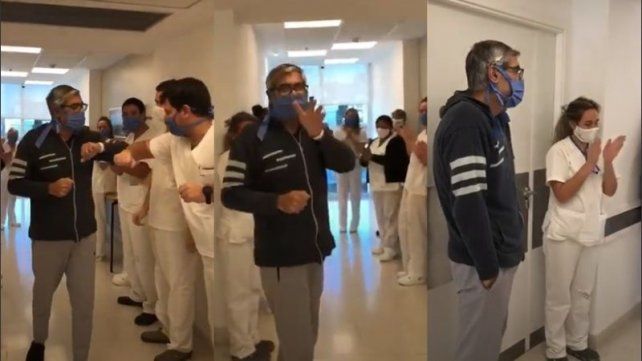 Hugo Ficca, paciente recuperado de coronavirus, es despedido con aplausos por el personal médico.