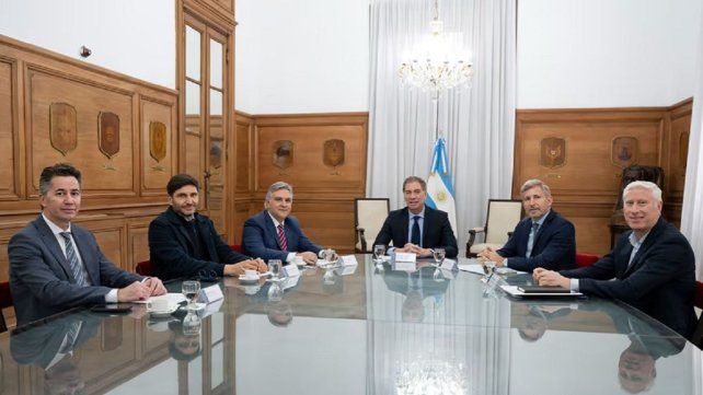 Con Rogelio Frigerio en el encuentro