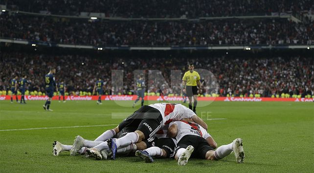 Juan Quintero of Argentina’s River Plate celebrates with his teammates after scoring River’s second goal in overtime against Argentina’s Boca Juniors during the Copa Libertadores final soccer match at the Santiago Bernabeu stadium in Madrid