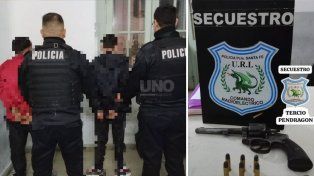 Los dos detenidos y el arma de guerra secuestrada