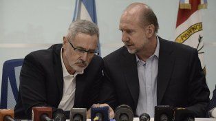 Marcelo Saín junto al exgobernador Omar Perotti