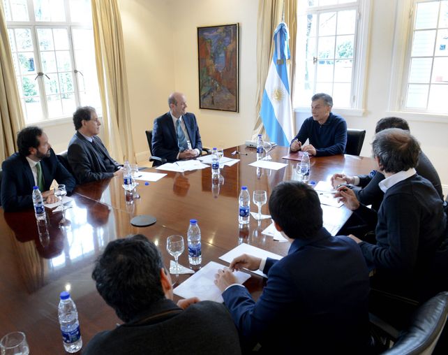 En Olivos. Las autoridades monetarias dialogaron ayer con el presidente.