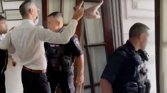 El momento en que el policía ingresa al estudio jurídico.&nbsp;