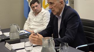 Rafael Catalano y Roberto Cristiá, durante la asamblea de AIM.