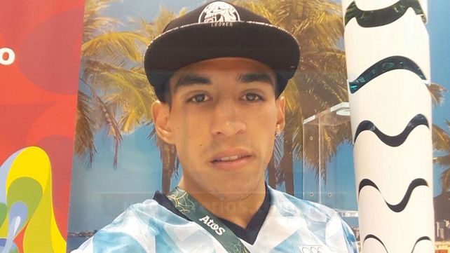 Con la llama Olímpica.