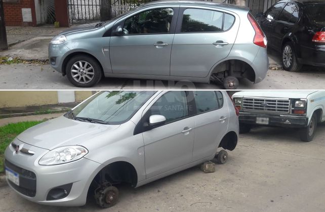 Los dos autos blancos de los robaruedas.