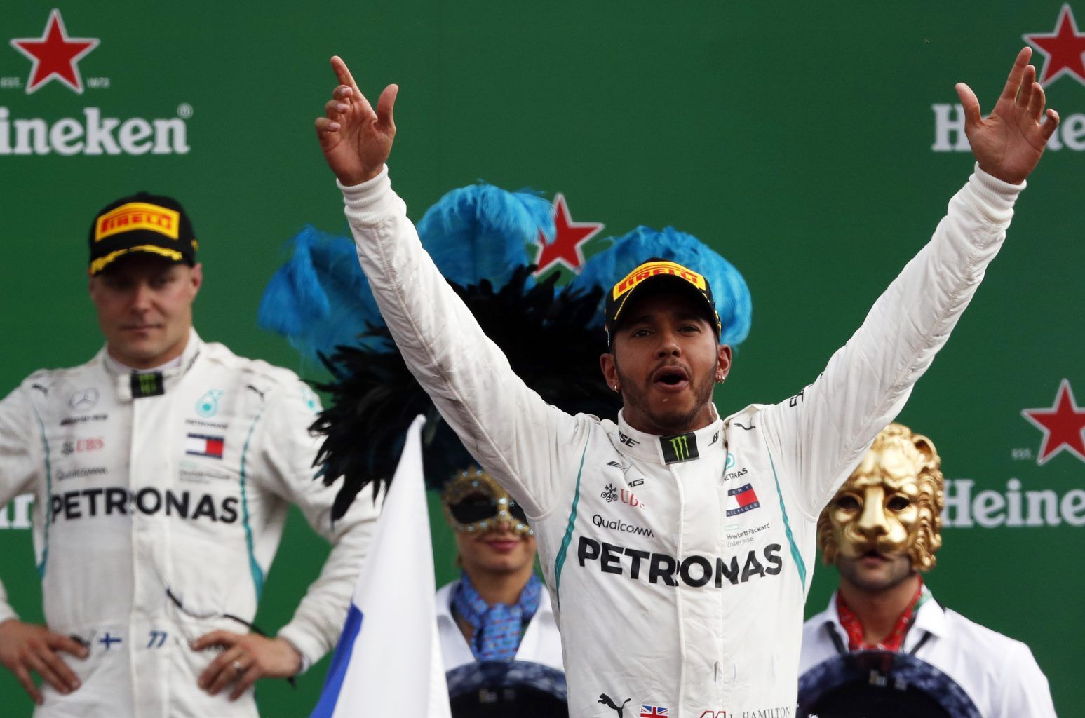 Mercedes driver Lewis Hamilton of Britain celebrates on the podium after winning the Formula One Italy Grand Prix at the Monza racetrack
