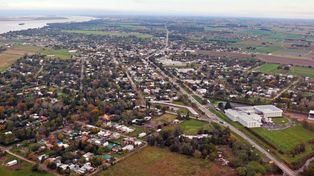 Vista aérea de Pueblo Esther, una de las ciudades del área metropolitana de Rosario, donde la Provincia sondea terrenos