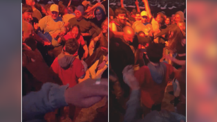 Un grupo de gente protegiendo a un niño en el recital de Los Fundamentalistas del Aire Acondicionado en Montevideo, Uruguay