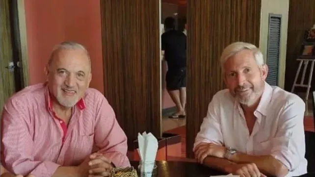 Miguel Rettore junto al gobernador Rogelio Frigerio