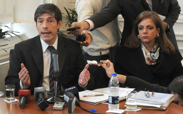 El jefe de Gabinete junto a la ministra de Seguridad Nilda Garré y el ministro de Economía Hernán Lorenzino.