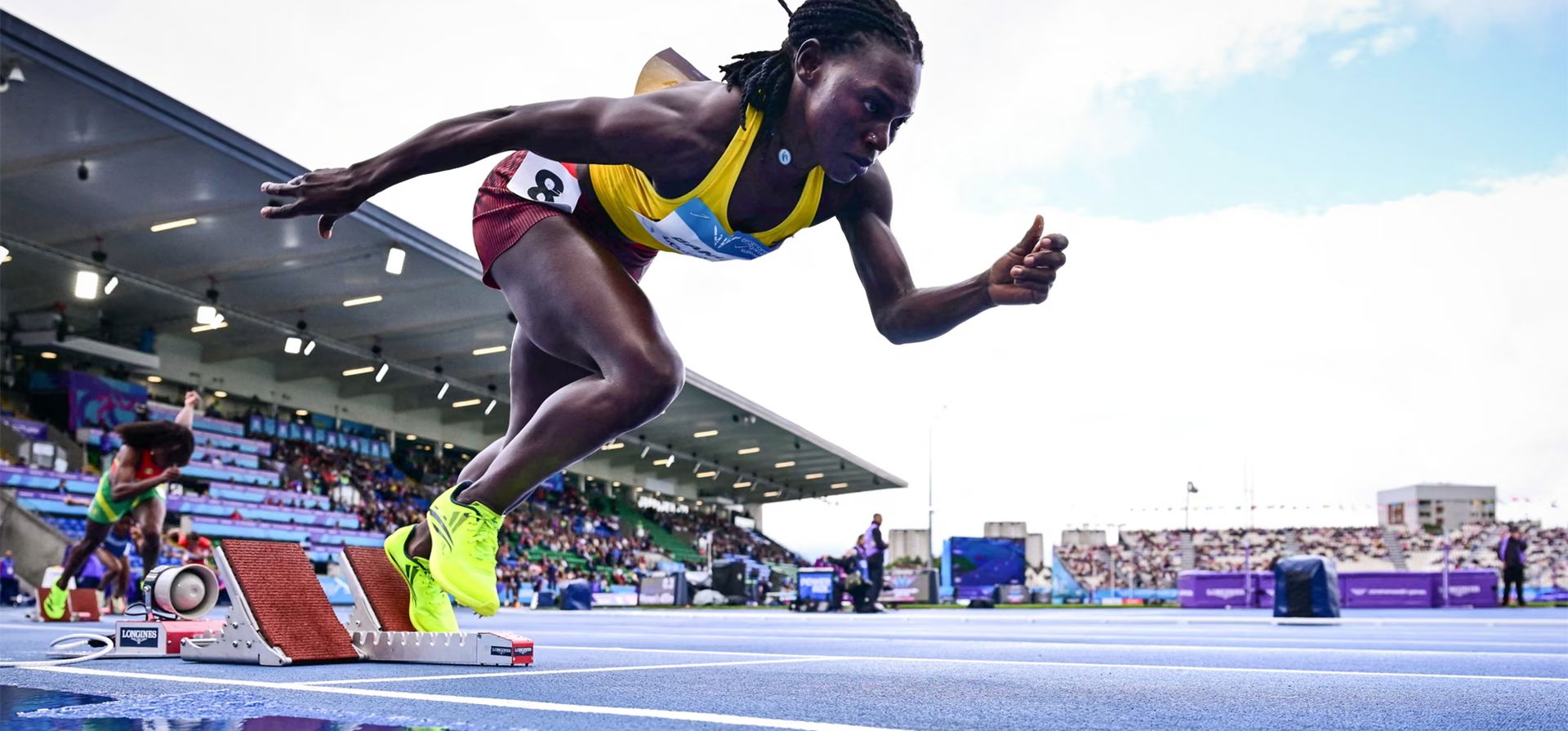 Mauren Akiiki Banura, de Uganda, compite en la primera serie de 400 metros femeninos en el estadio Scotstoun durante los Juegos de la Commonwealth, Glasgow, Escocia. Fotografía: Ben Stansall/AFP/Getty Images