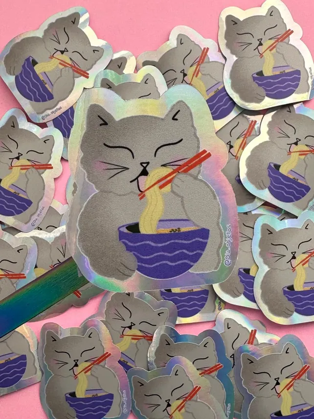 El gato, adorable mascota que se convirtió en ícono de la cultura pop. Stickers, totesbags, prendas de ropa y arte inspirado -y con forma de- felinos podrá comprarse en la Kittyferia