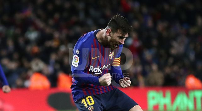 FC Barcelona’s Lionel Messi celebrates after scoring during the Spanish La Liga soccer match between FC Barcelona and Valencia at the Camp Nou stadium in Barcelona